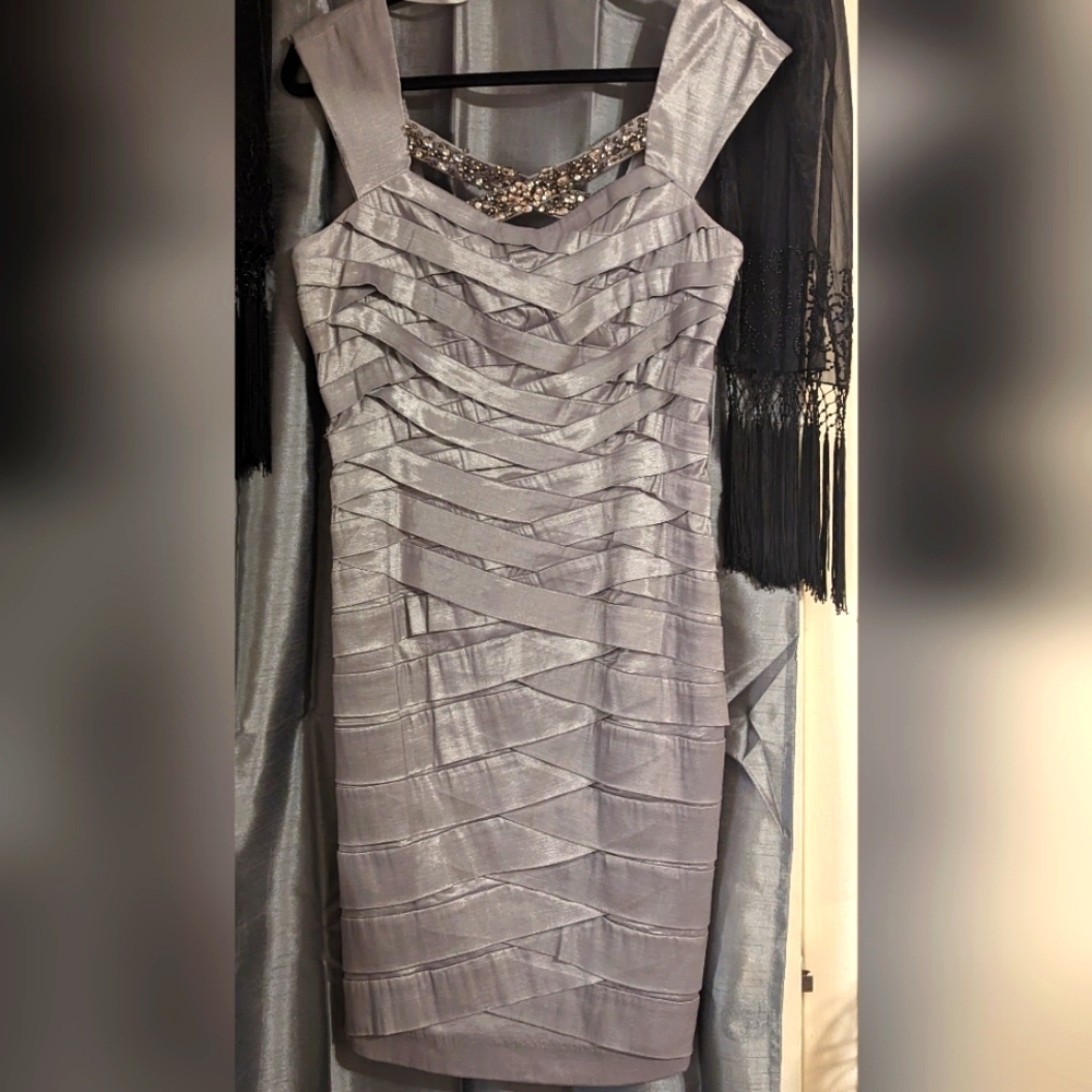 Silver size 10, with beading, body contouring dress.